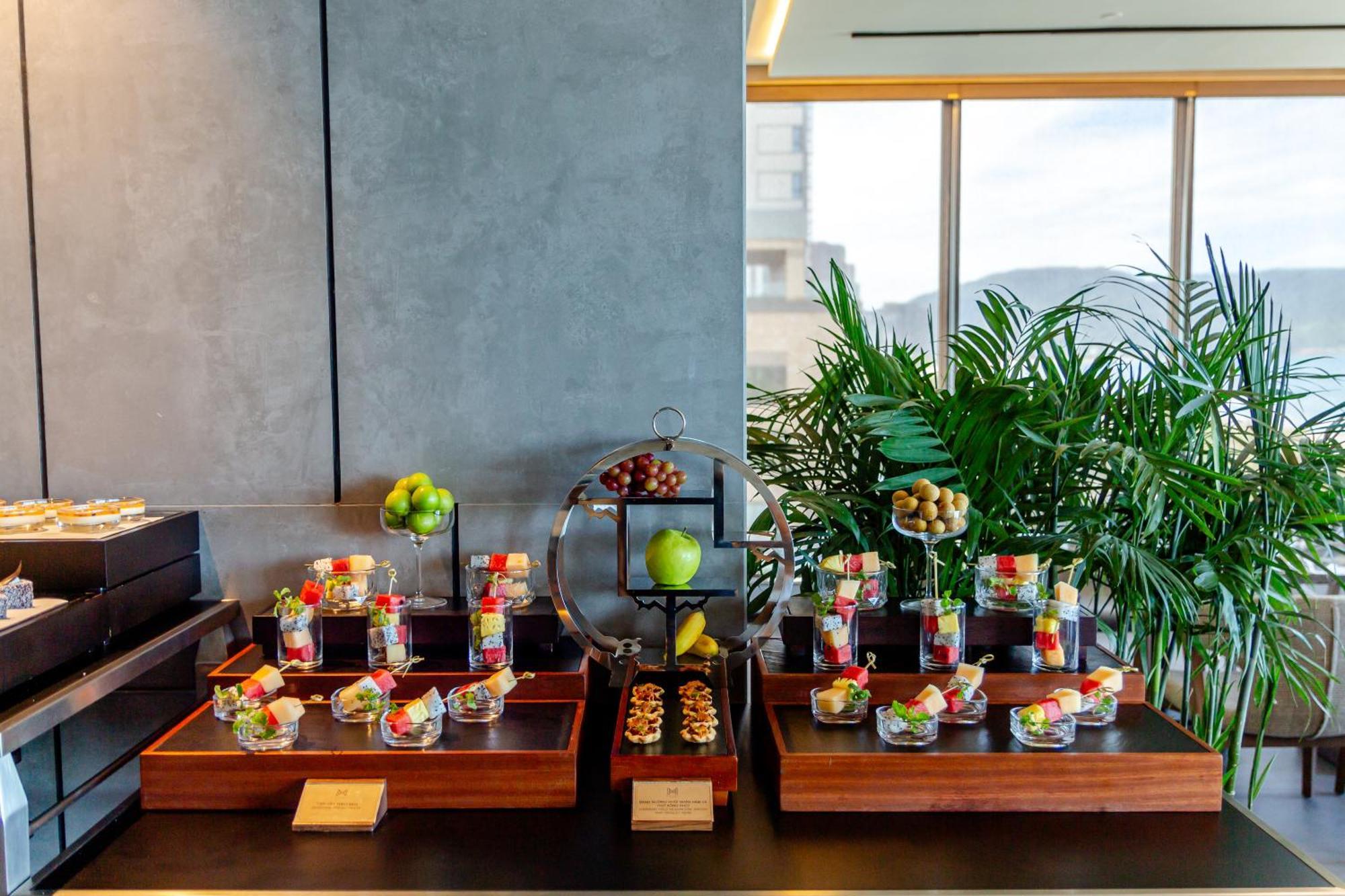 M Hotel Danang Экстерьер фото A selection of desserts at the lounge